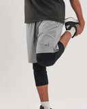 Grey Awrah Shorts, liner covers the knee in a quad stretch